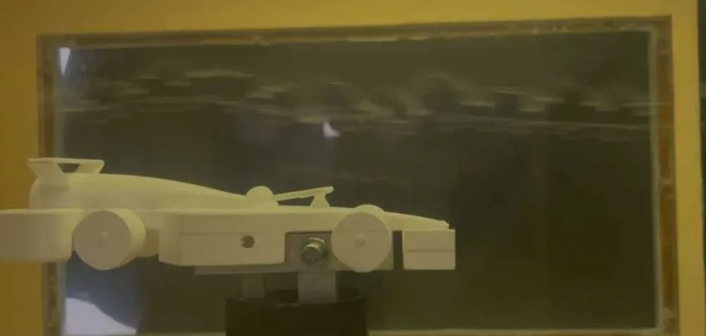 Aztech Motorsport's model car mounted in the IARE low-speed wind tunnel, side view through the test-section window